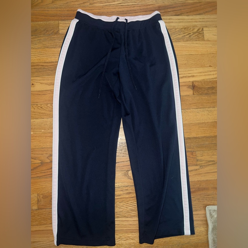Navy blue joggers with pink stripes on the side